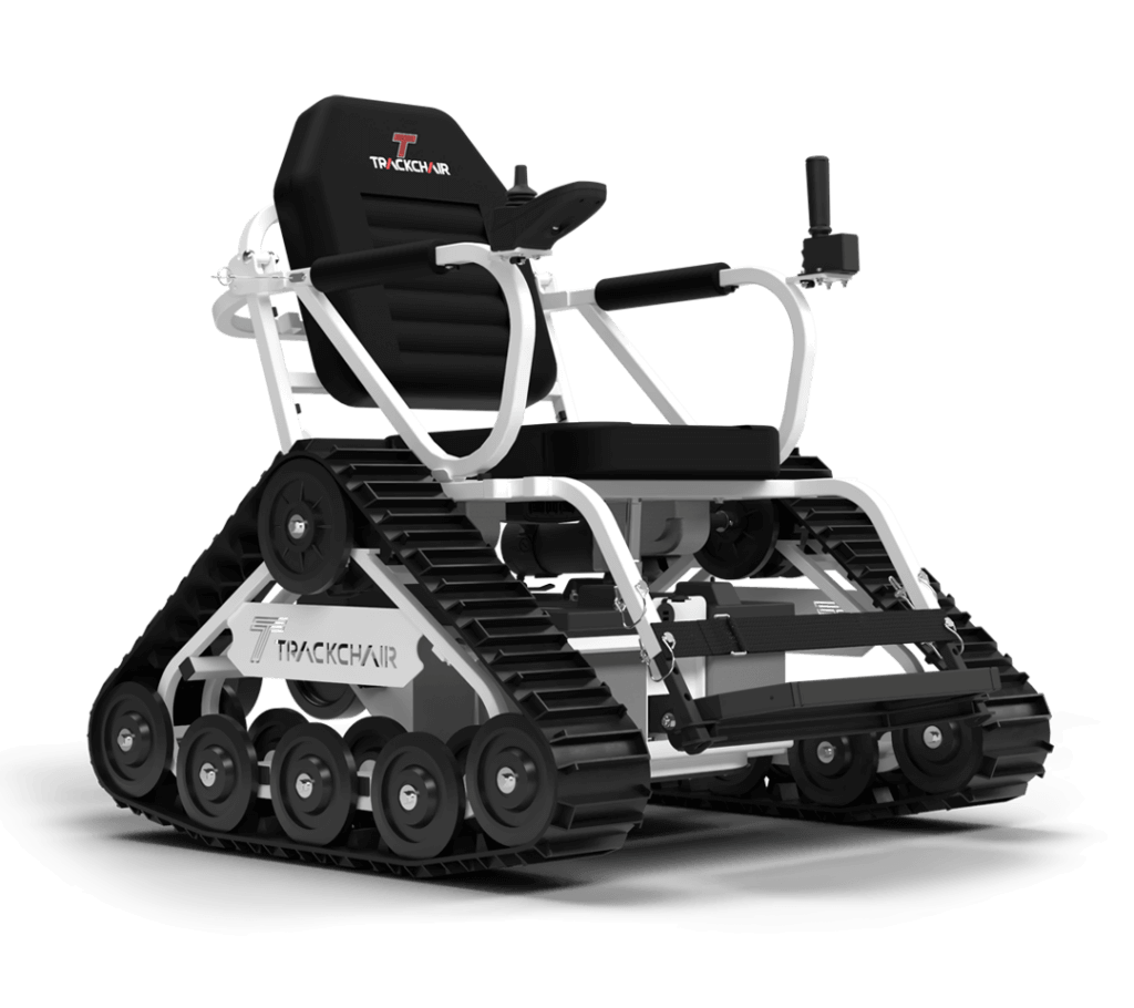 The Action Trackchair NT narrow-body power wheelchair with a white frame and black tank treads. It features a contoured black seat with the red 'T' logo, a joystick controller, and a specialized gun rack mount on the left armrest, designed for independent off-road mobility.