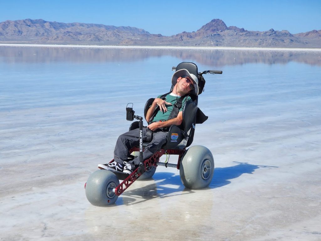 Man with cerebral palsy in an all-terrain wheelchair