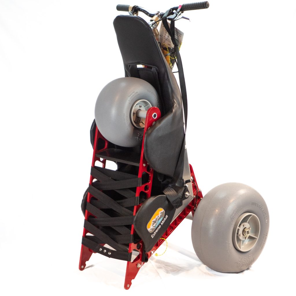 Extreme Motus all terrain wheelchair folded in half for transport or storage.