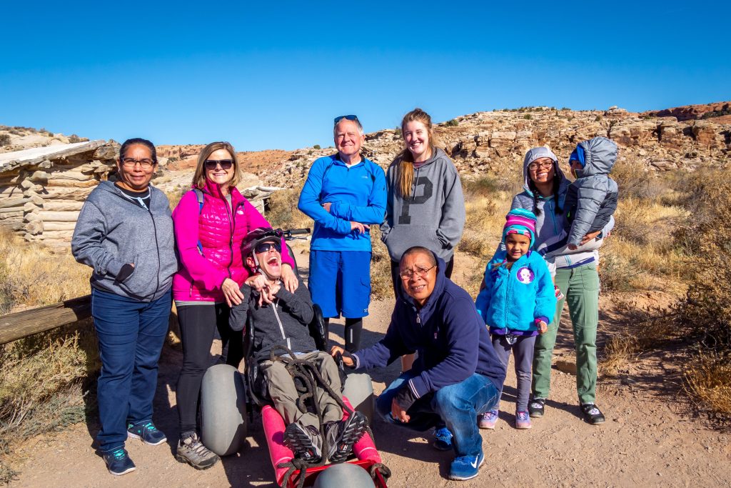 Family hiking together in Arches National Park with the Extreme Motus all terrain wheelchair