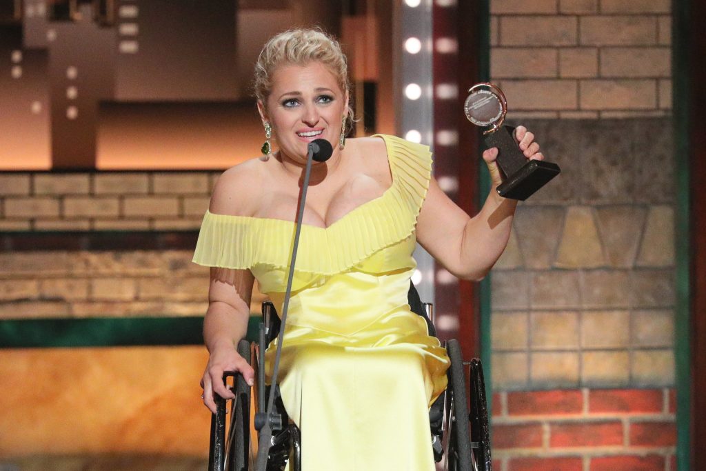 Ali Stroker receiving a Tony in her wheelchair.