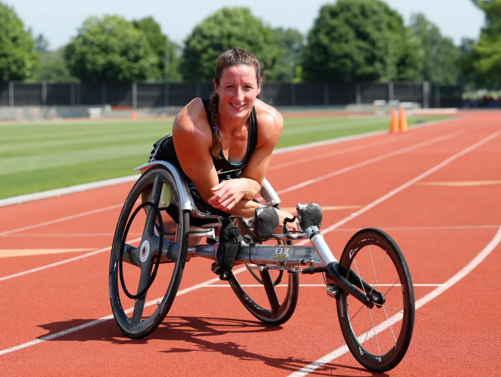 Tatyana McFadden sits in her special marathon wheelchair on a track.