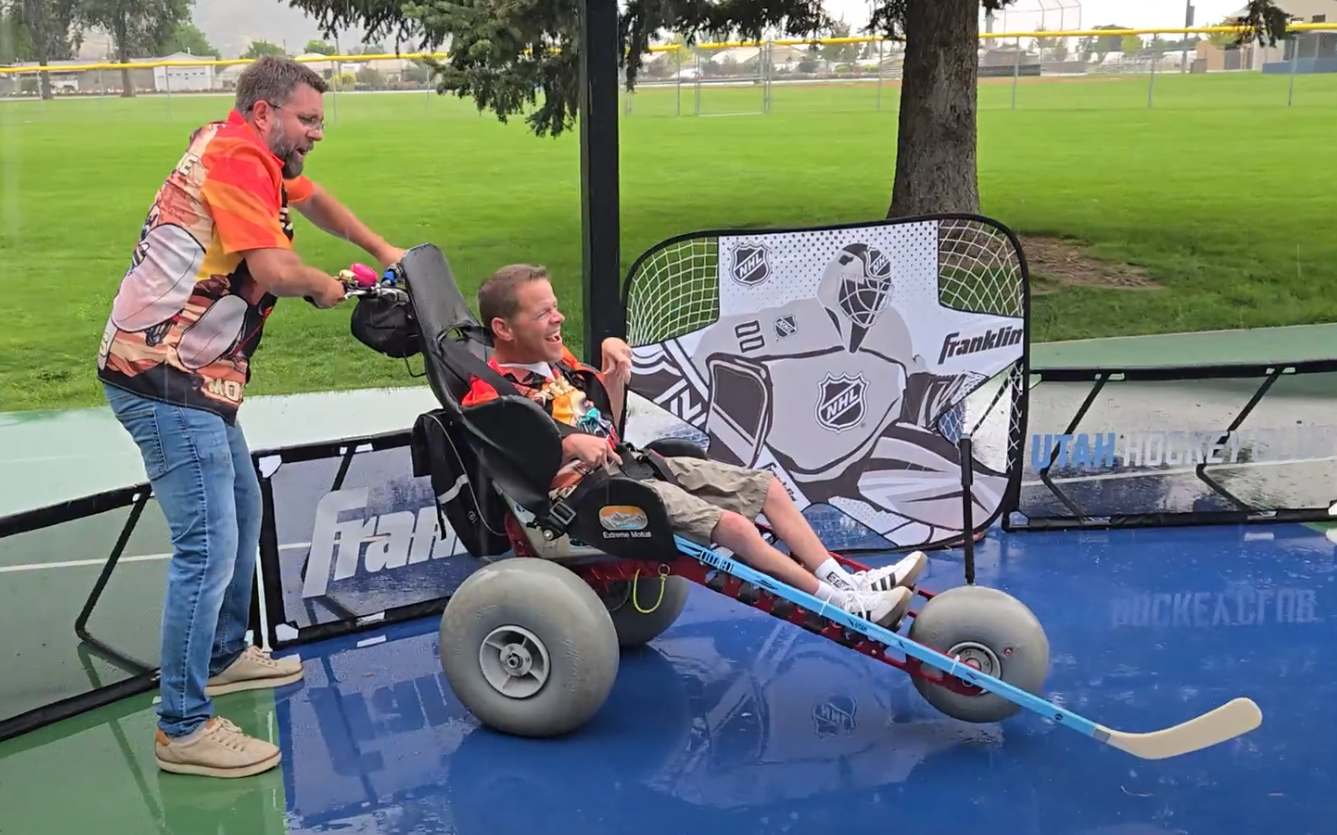 Sam plays street hockey in the Extreme Motus all terrain wheelchair