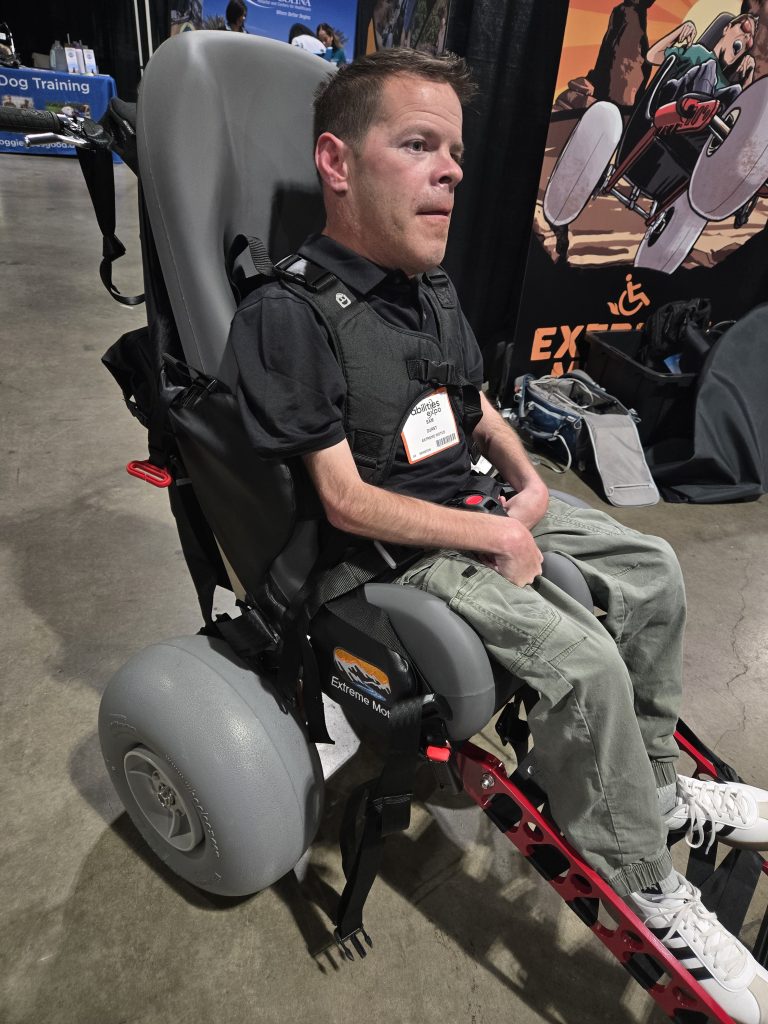 Sam using his Special Tomato seat with his all terrain wheelchair