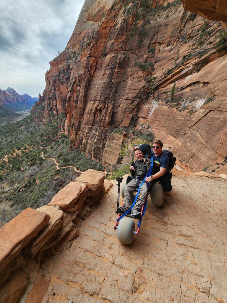 The Extreme Motus wheelchair on a cliffside overlook trail in Zion National Park